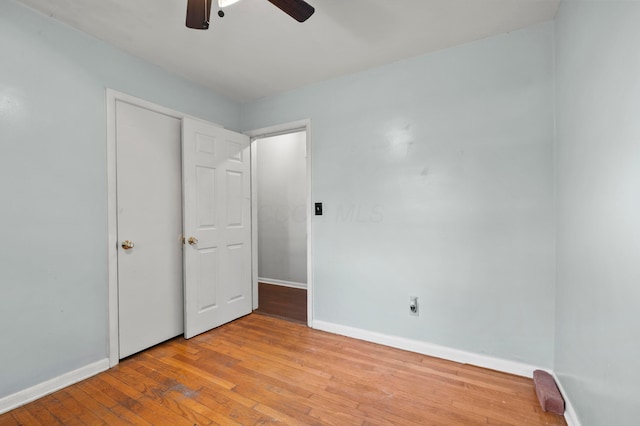 3191 S Stephen Dr, Columbus, OH 43204 - unfurnished bedroom with hardwood / wood-style floors, baseboards, and ceiling fan