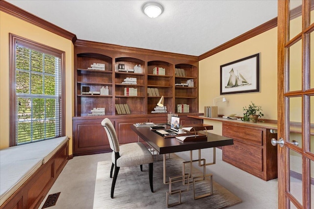 3144 Abbey Knoll Dr, Lewis Center, OH 43035 - office area featuring crown molding, light carpet, built in study area, built in shelves, and a textured ceiling
