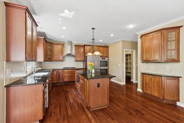 3144 Abbey Knoll Dr, Lewis Center, OH 43035 - kitchen featuring wall chimney range hood, a sink, stainless steel appliances, a center island, and decorative backsplash