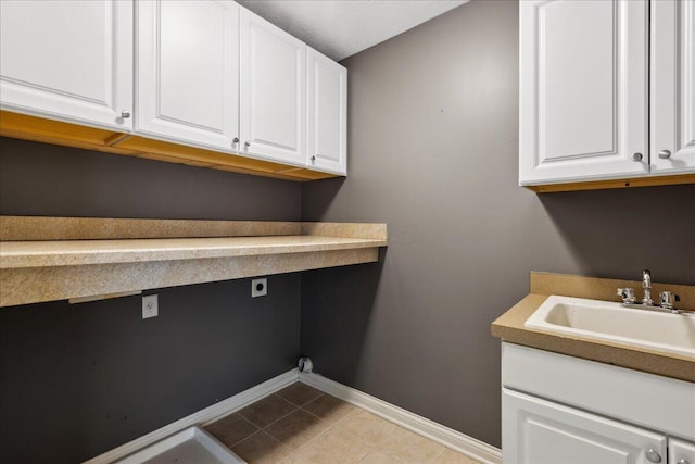 3144 Abbey Knoll Dr, Lewis Center, OH 43035 - laundry room featuring hookup for an electric dryer, baseboards, light tile patterned flooring, and cabinet space