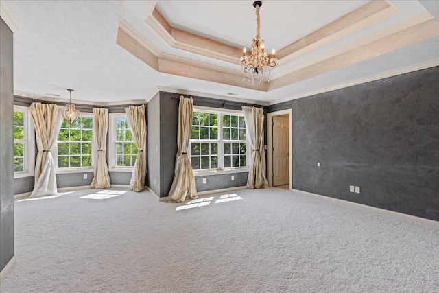 3144 Abbey Knoll Dr, Lewis Center, OH 43035 - spare room with a chandelier, ornamental molding, carpet flooring, baseboards, and a raised ceiling