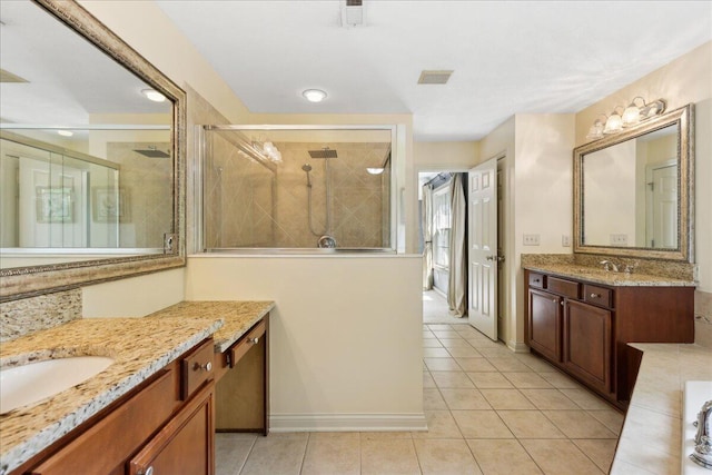 3144 Abbey Knoll Dr, Lewis Center, OH 43035 - full bath featuring a stall shower, tile patterned flooring, two vanities, and baseboards
