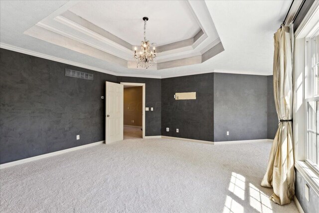 3144 Abbey Knoll Dr, Lewis Center, OH 43035 - unfurnished room featuring a chandelier, a tray ceiling, carpet floors, baseboards, and crown molding