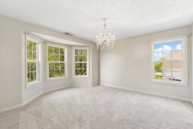 3144 Abbey Knoll Dr, Lewis Center, OH 43035 - spare room with a chandelier, baseboards, and carpet flooring