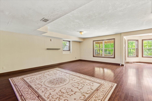 3144 Abbey Knoll Dr, Lewis Center, OH 43035 - empty room featuring dark wood-style floors, a textured ceiling, and baseboards