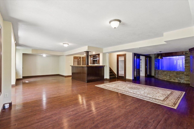 3144 Abbey Knoll Dr, Lewis Center, OH 43035 - unfurnished living room with wood finished floors, baseboards, and stairway