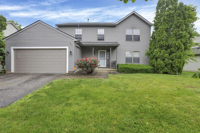 6792 Makady Rd, Canal Winchester, OH 43110 - traditional home with asphalt driveway, a garage, and a front yard