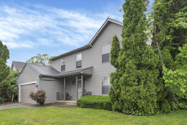 6792 Makady Rd, Canal Winchester, OH 43110 - traditional home featuring an attached garage, a front yard, asphalt driveway, and covered porch