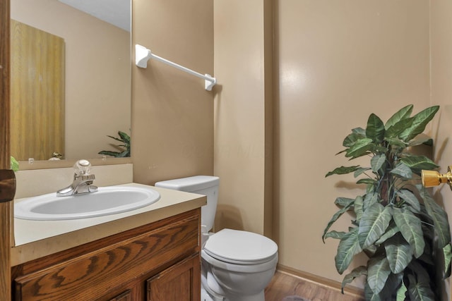 6792 Makady Rd, Canal Winchester, OH 43110 - bathroom with toilet, vanity, and wood finished floors