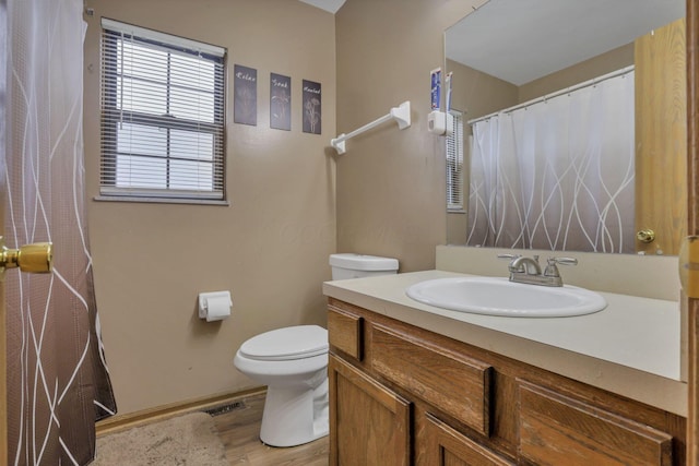 6792 Makady Rd, Canal Winchester, OH 43110 - bathroom featuring toilet, vanity, wood finished floors, and a shower with curtain