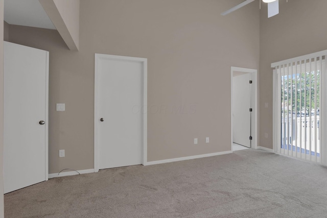 1722 Rock Creek Dr, Grove City, OH 43123 - carpeted spare room with a towering ceiling, a ceiling fan, and baseboards