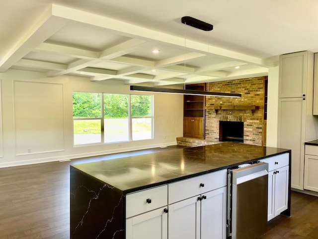 1071 US-42, London, OH 43140 - kitchen featuring open floor plan, dark wood-type flooring, dark countertops, beam ceiling, and coffered ceiling