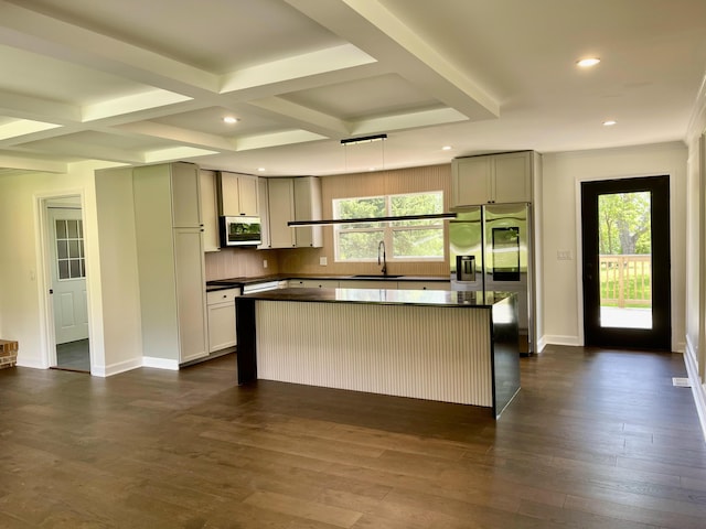 1071 US-42, London, OH 43140 - kitchen with a sink, dark countertops, appliances with stainless steel finishes, a kitchen island, and healthy amount of natural light
