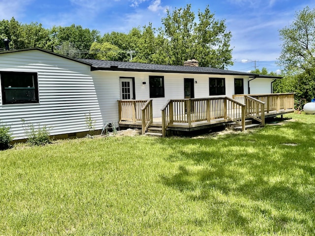 1071 US-42, London, OH 43140 - rear view of house with crawl space, a chimney, a deck, and a lawn