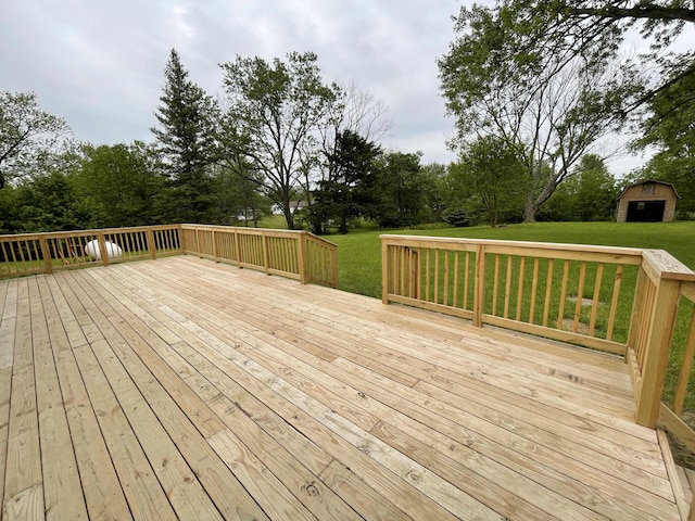 1071 US-42, London, OH 43140 - wooden terrace with a yard, an outdoor structure, and view of wooded area