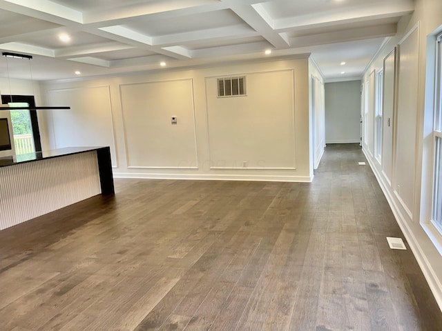 1071 US-42, London, OH 43140 - unfurnished living room with a decorative wall, beamed ceiling, dark wood-type flooring, coffered ceiling, and recessed lighting