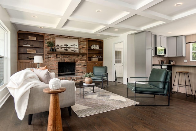 1071 US-42, London, OH 43140 - living area with coffered ceiling, a fireplace, dark wood finished floors, beam ceiling, and built in features