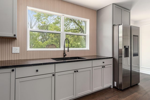 1071 US-42, London, OH 43140 - kitchen featuring stainless steel fridge with ice dispenser, a sink, dark countertops, dark wood finished floors, and crown molding
