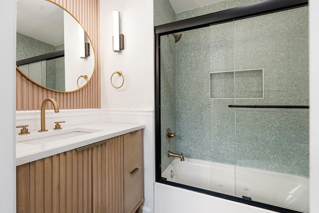 1071 US-42, London, OH 43140 - full bath with vanity, enclosed tub / shower combo, and wainscoting