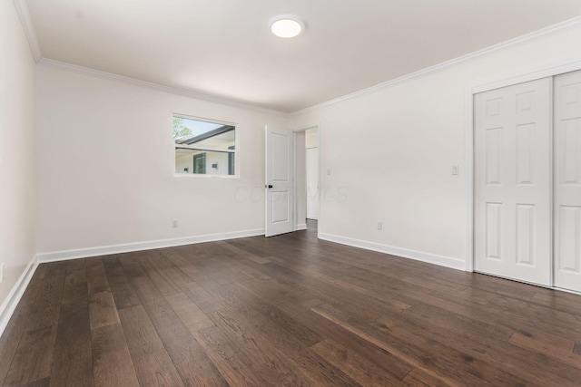 1071 US-42, London, OH 43140 - unfurnished room with dark wood-style flooring, ornamental molding, and baseboards