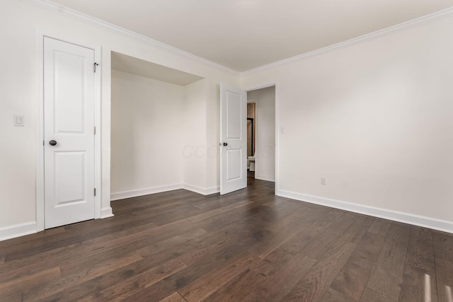 1071 US-42, London, OH 43140 - unfurnished room featuring dark wood-style floors, crown molding, and baseboards