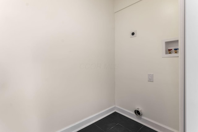 1071 US-42, London, OH 43140 - laundry area featuring baseboards, electric dryer hookup, dark tile patterned flooring, and washer hookup