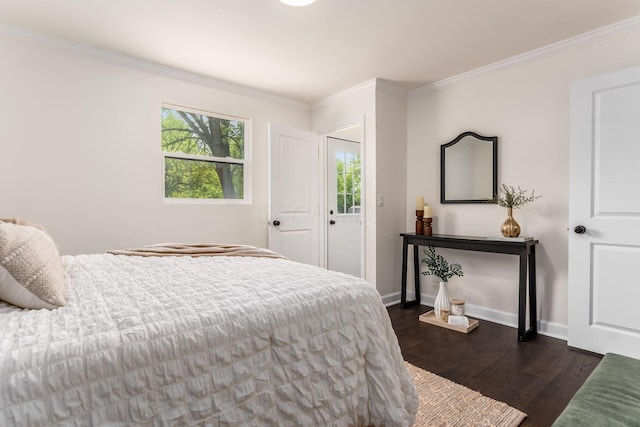 1071 US-42, London, OH 43140 - bedroom with dark wood-style flooring, crown molding, and baseboards
