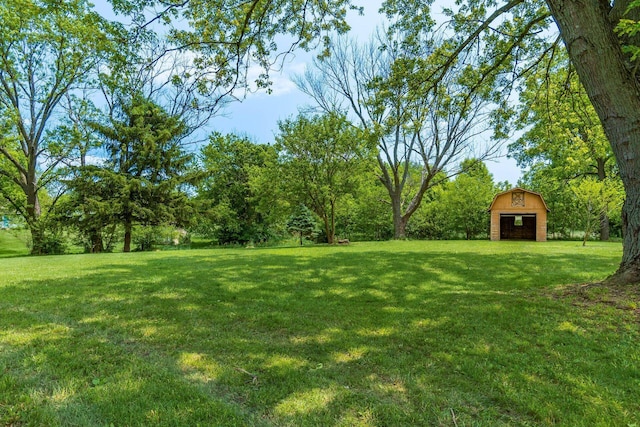 1071 US-42, London, OH 43140 - view of green lawn featuring a barn and an outbuilding
