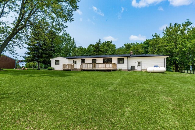 1071 US-42, London, OH 43140 - back of house with a deck, a yard, and central air condition unit