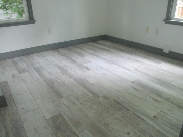 1056 Geers Ave, Columbus, OH 43206 - empty room with wood finished floors and baseboards