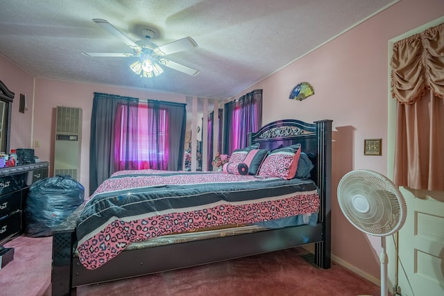 2929 Fairwood Ave, Columbus, OH 43205 - carpeted bedroom featuring a heating unit, a textured ceiling, ceiling fan, and baseboards