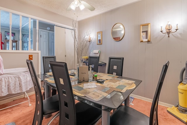 2929 Fairwood Ave, Columbus, OH 43205 - dining area featuring a ceiling fan, carpet flooring, a textured ceiling, a desk, and baseboards