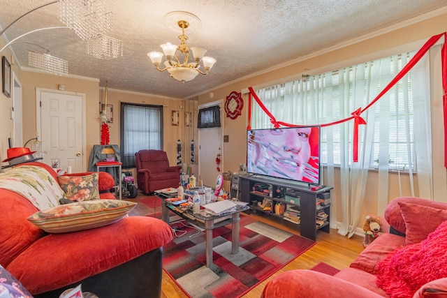 2929 Fairwood Ave, Columbus, OH 43205 - living room featuring a chandelier, ornamental molding, wood finished floors, and a textured ceiling