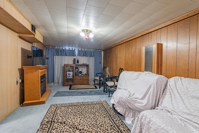 2929 Fairwood Ave, Columbus, OH 43205 - sitting room featuring light colored carpet, wood walls, and a fireplace