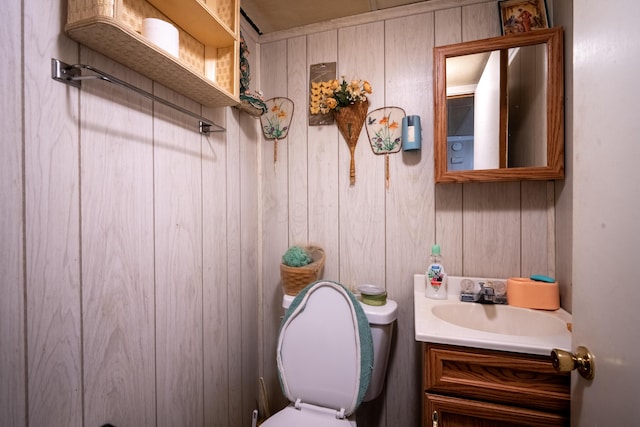 2929 Fairwood Ave, Columbus, OH 43205 - bathroom with vanity, wood walls, and toilet