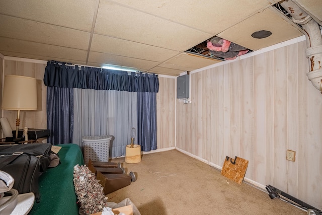 2929 Fairwood Ave, Columbus, OH 43205 - carpeted cinema with electric panel, a paneled ceiling, and wood walls