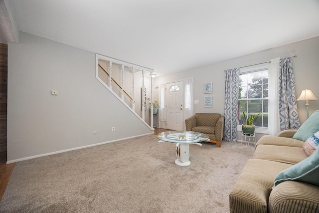 2349 Hardesty Dr N Unit B9, Columbus, OH 43204 - carpeted living room featuring stairs and baseboards