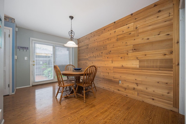 2349 Hardesty Dr N Unit B9, Columbus, OH 43204 - dining area featuring wooden walls, wood finished floors, and baseboards