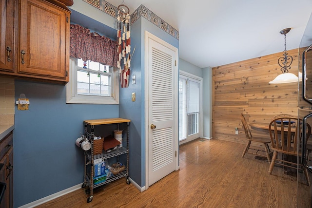 2349 Hardesty Dr N Unit B9, Columbus, OH 43204 - dining room featuring wood finished floors, wooden walls, and baseboards