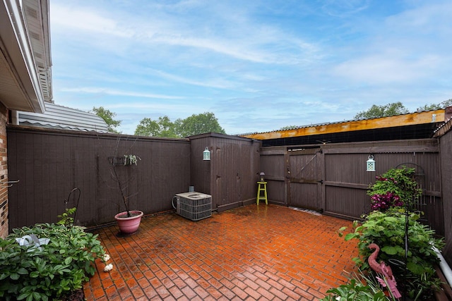 2349 Hardesty Dr N Unit B9, Columbus, OH 43204 - fenced backyard featuring a gate, central AC unit, and a patio