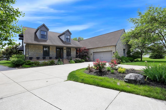 3171 Orders Rd, Grove City, OH 43123 - cape cod home with stone siding, driveway, a porch, and a garage