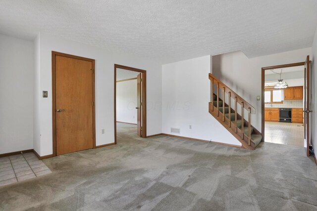 3171 Orders Rd, Grove City, OH 43123 - empty room with stairway, carpet, baseboards, and a textured ceiling