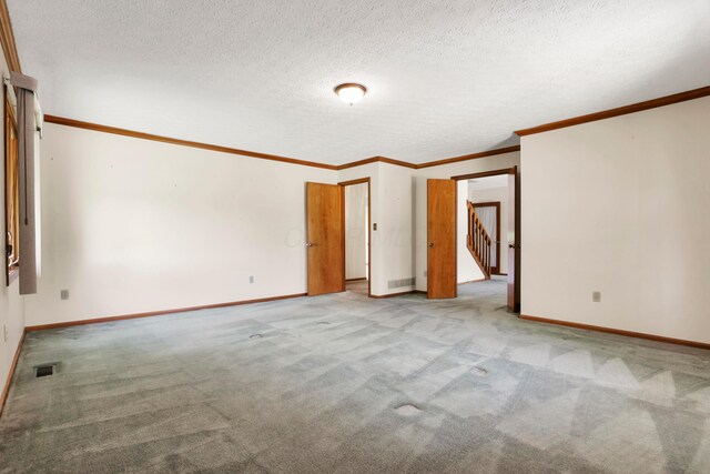 3171 Orders Rd, Grove City, OH 43123 - empty room featuring light carpet, baseboards, ornamental molding, and a textured ceiling
