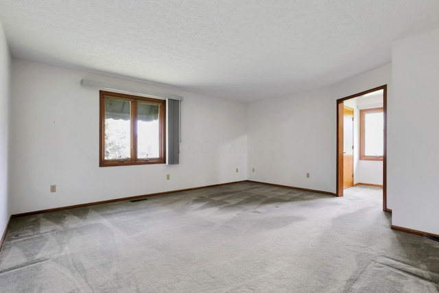 3171 Orders Rd, Grove City, OH 43123 - carpeted empty room with baseboards and a textured ceiling