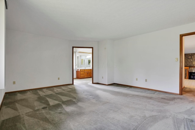 3171 Orders Rd, Grove City, OH 43123 - spare room featuring light carpet, baseboards, and a brick fireplace