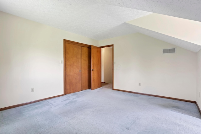 3171 Orders Rd, Grove City, OH 43123 - bonus room with light carpet, baseboards, lofted ceiling, and a textured ceiling