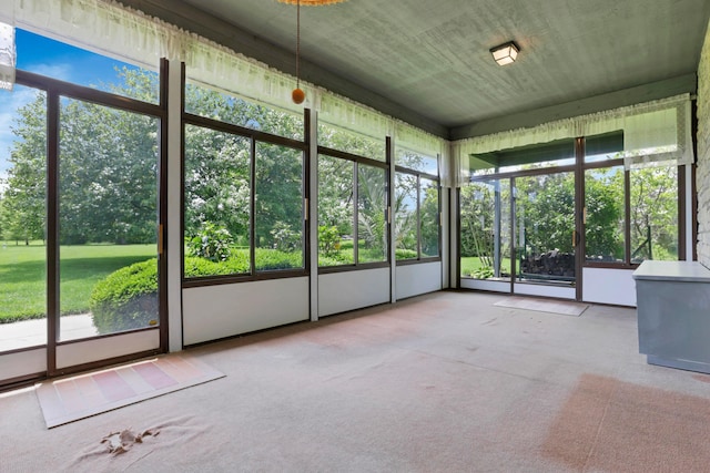 3171 Orders Rd, Grove City, OH 43123 - unfurnished sunroom with plenty of natural light and view of wooded area
