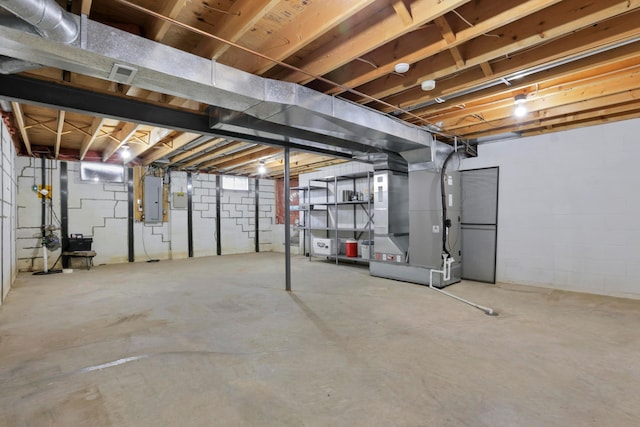 3171 Orders Rd, Grove City, OH 43123 - unfinished below grade area with electric panel, heating unit, and concrete block wall