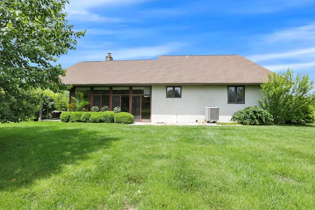 3171 Orders Rd, Grove City, OH 43123 - back of house with central AC unit, stucco siding, a yard, and roof with shingles