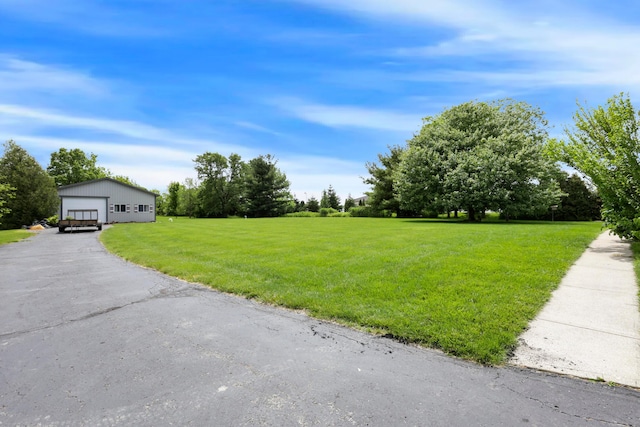 3171 Orders Rd, Grove City, OH 43123 - view of green lawn with a detached garage and an outdoor structure